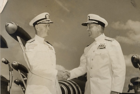Felix B. Stump and Arthur W. Radford in dress whites, shaking hands (ddr-njpa-2-928)