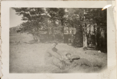 Two men relaxing in field (ddr-densho-466-275)