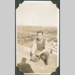 Man kneeling on rooftop (ddr-ajah-2-719)