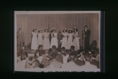 (Slide) - Image of group of women in dresses standing on stage (ddr-densho-330-209-master-9cab659957)