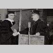 Gregg M. Sinclair receiving honorary degree from Paul S. Bachman (ddr-njpa-2-1157)