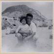 Man with small girl on beach (ddr-densho-522-296)