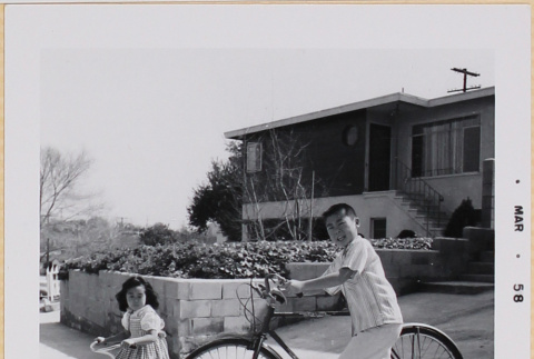 Susan and William Shiomi riding bikes (ddr-densho-522-486)