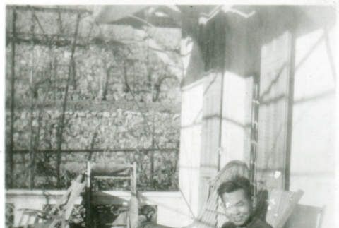 Man on porch (ddr-densho-1007-612)