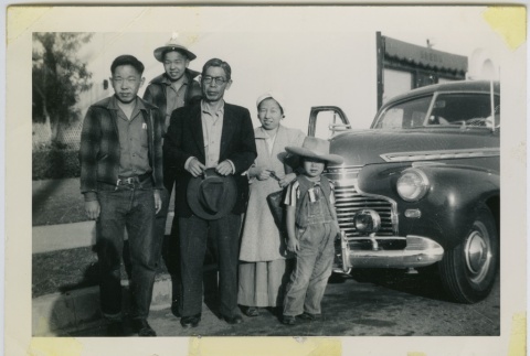 Japanese American family preparing for the journey to the Pomona Assembly Center (ddr-densho-242-4)