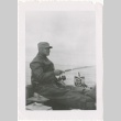 Man fishing in boat (ddr-densho-326-9)