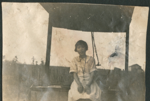 Woman sitting in shelter (ddr-densho-316-309)