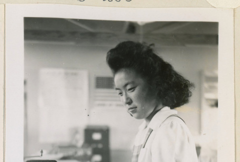 Woman using a typewriter (ddr-densho-37-1002)