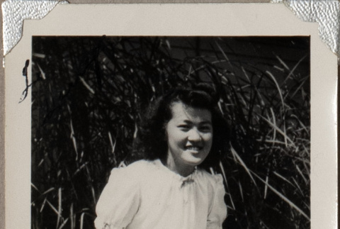 Woman kneeling on lawn (ddr-densho-587-61)