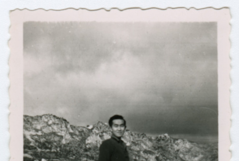 Soldier standing on ledge in front of mountains (ddr-densho-368-241)