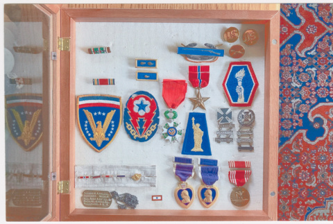 Wooden case of medals, patches and pins (ddr-densho-539-142)