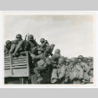 Japanese-American members of the 442nd climb into truck (ddr-densho-1007-146)