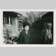 Tomoye Takahashi and unknown man outside building (ddr-densho-426-1082)