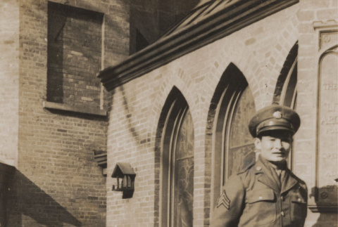 Soldier in front of brick building (ddr-janm-17-51)