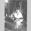 Nisei man playing the guitar (ddr-densho-157-78)