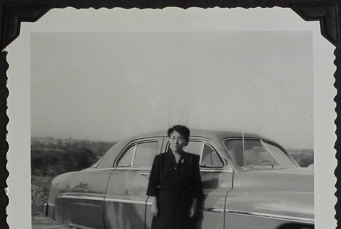 A woman in front of a car (ddr-densho-300-424)