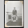 Tokeo Tagami poses with a life preserver (ddr-densho-404-62)