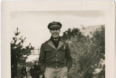 Man in uniform walking on path (ddr-densho-426-1415)