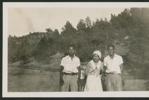three people in front of car (ddr-densho-378-889)