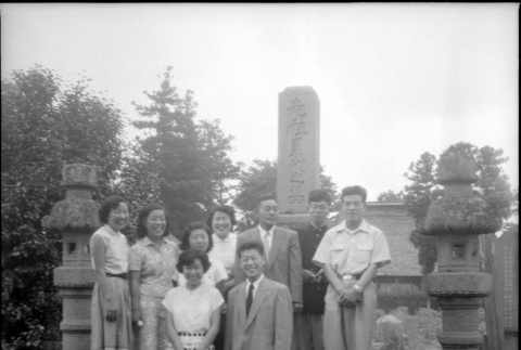 Group standing by stones in cemetery (ddr-densho-426-2471)