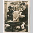 Boy and girl watching two men demonstrating carving at Japanese Pavilion at the Golden Gate International Exposition (ddr-densho-426-2088)