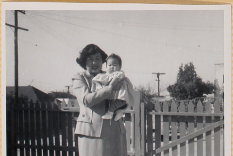 Yoshiko Shiomi holding Susan Shiomi (ddr-densho-522-199)