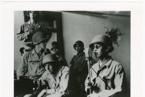 Serviceperson speaking into microphone (ddr-densho-1007-237)