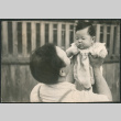 Man holding baby (ddr-densho-523-65)
