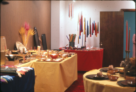 Displays of table settings, candles and metallic lacquerware (ddr-densho-426-376)