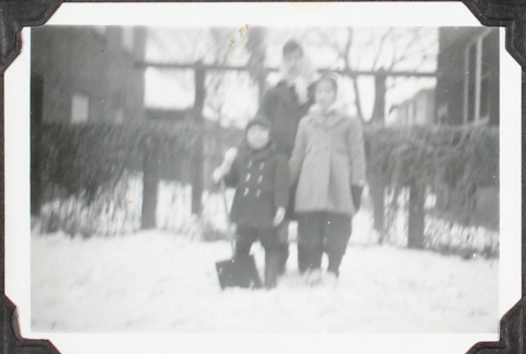Women and two children in snow (ddr-densho-355-864)