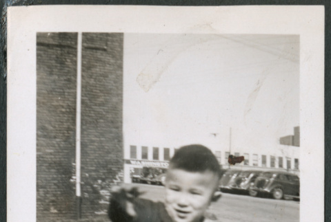 Photo of a child squatting (ddr-densho-483-766)