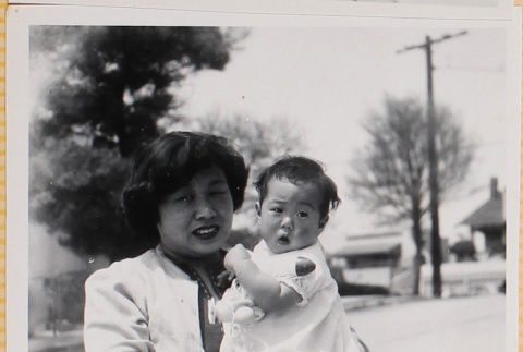 Yoshiko Shiomi holding Susan Shiomi (ddr-densho-522-158)