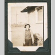 Woman in front of house (ddr-densho-550-292)