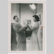 A man and woman exchanging a present (ddr-densho-338-269)