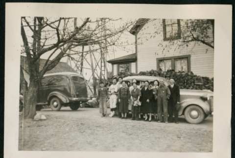 Group photograph in front of car (ddr-densho-359-358)