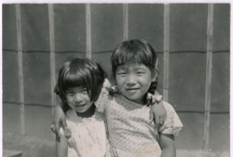 Two Japanese American girls pose for photo (ddr-densho-362-3)