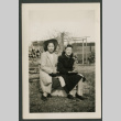 Two women pose on box (ddr-densho-359-169)