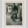 Soldier kneeling along city street (ddr-densho-368-95)