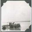 Group of men on shore with boat (ddr-ajah-2-166)