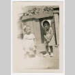 Photograph of two toddler standing outside (ddr-densho-329-409)