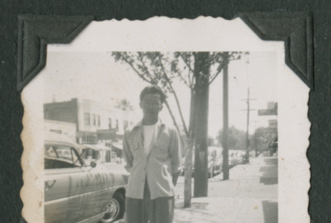 Man standing on a city street (ddr-densho-471-197)