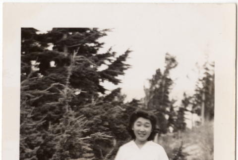 Dorothy standing by tree (ddr-densho-409-58)