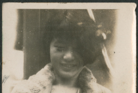 Woman leaning against wall (ddr-densho-523-8)