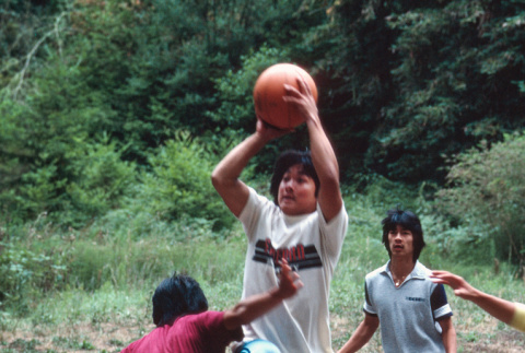 Jeff Sasagawa shooting the basketball (ddr-densho-336-1294)