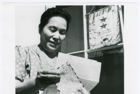 Woman receiving letter (ddr-densho-1007-342)