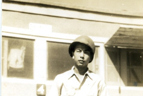 Soldier standing in front of barracks (ddr-densho-22-198)