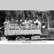 Group of children and adults in the back of a truck (ddr-ajah-4-48)