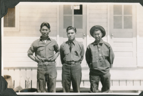 Three men standing outside building.  Joe Iwataki on left (ddr-ajah-2-142)