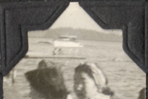 Two women sitting by shore (ddr-densho-466-947)