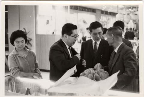 Group standing at counter (ddr-densho-426-67)